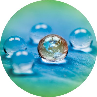 World surrounded by liquid droplets on a leaf